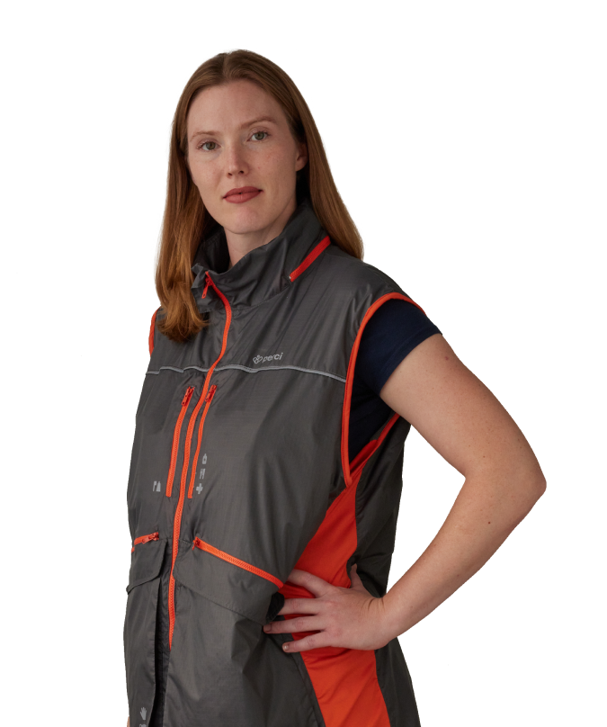 Young woman in Perci evacuation Vest with hand resting on the left waist looking straight at the camera